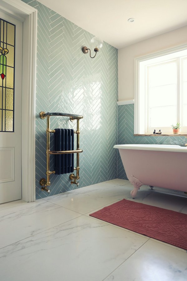 How do you design a UK bathroom that is easy to clean and maintain?